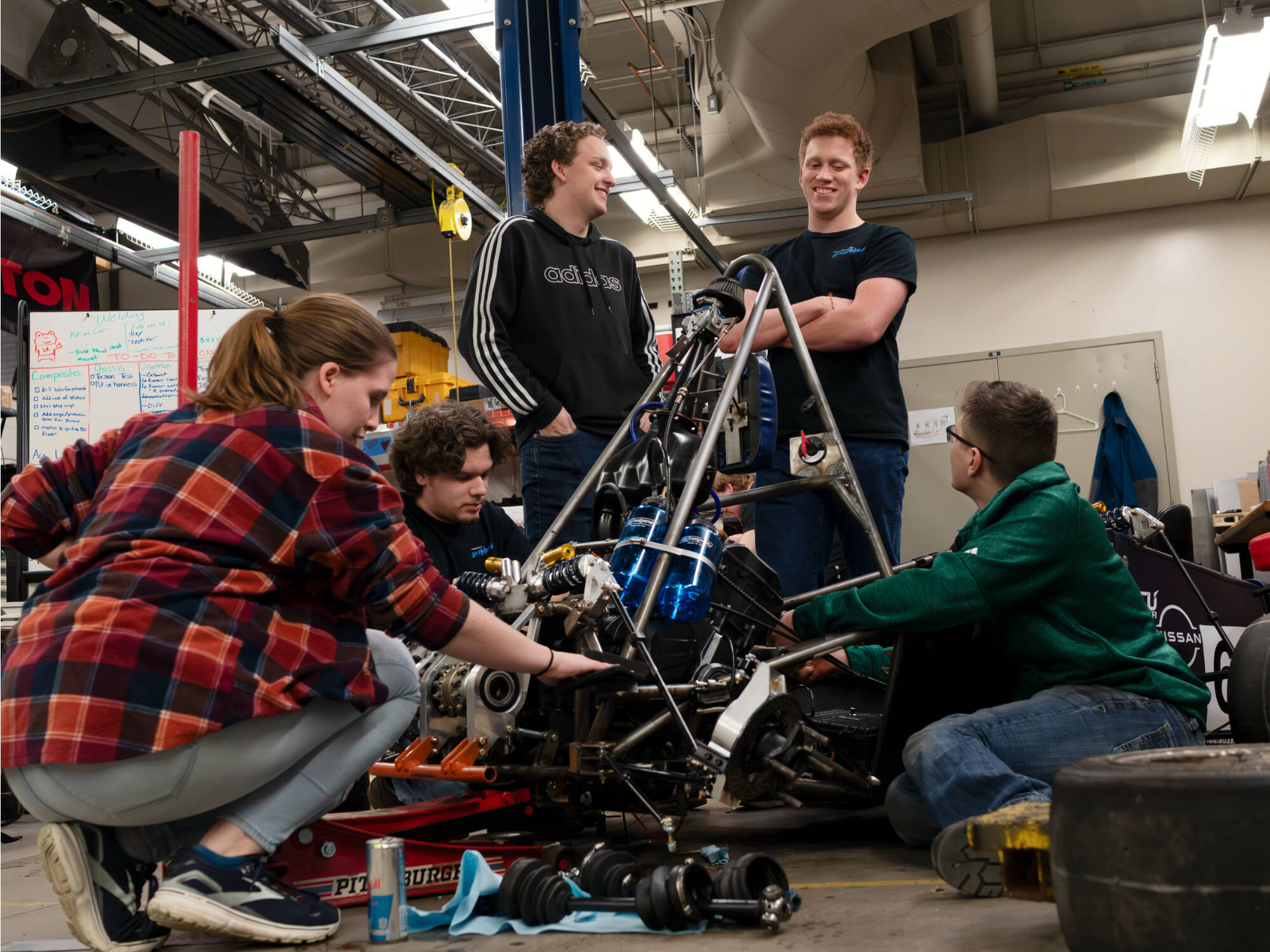 Members of the GVSU Formula SAE Racing Team (from left) mechanical engineering major Annika Mattson, mechanical engineering major Hunter Kruep, mechanical engineering major Thomas Helquist, mechanical engineering major Ethan Whiting and mechanical engi...